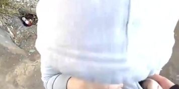 Asian beauty blowing fat cock outside