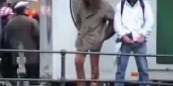 Shameless pissing woman is getting voyeured outdoor