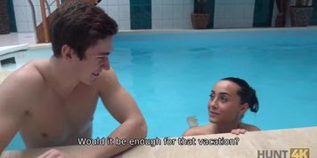 HUNT4K. Slim brunette has sex with stranger by the pool near her man