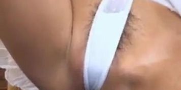 Horny Misora strips and fucks her hairy pussy with a cucumber