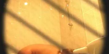 Naughty brunette mature chick  plays with her pussy in the shower