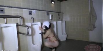 A woman who masturbates in the men's toilet at midnight