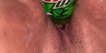 Bottle in her pussy