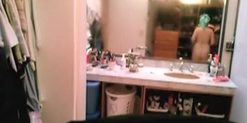 Milf caught after taking shower