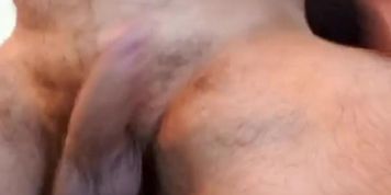 Muscle bear flexes and drops a thick cum load