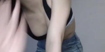 Sexy brunette WebCam model flashes her boobs
