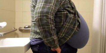 Massive gut hanging in shirt