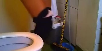 Woman taking a seat in toilet and peeing