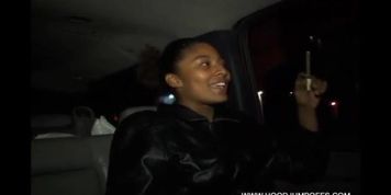 Playing with her black pussy on the backseat