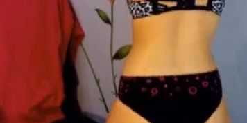Curvy teen doing a striptease