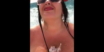 German milf with huge tits gives a blowjob handjob and tit screw in a hot tub