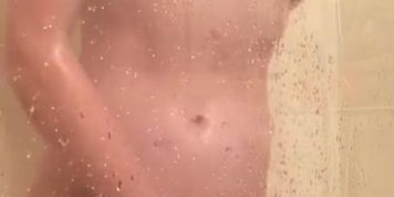 Redhead masturbating in the shower