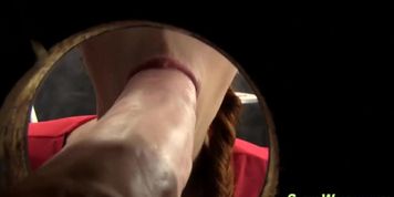 Gloryhole slut rubs pussy
