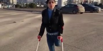 Beautiful girl walking down the street