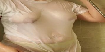 Sexy wet t shirt girl plays with pussy in shower 