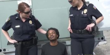 Two nasty female cops get their wet hungry pussies banged by horny black felon