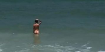 Nude Beach Playing in the Waves