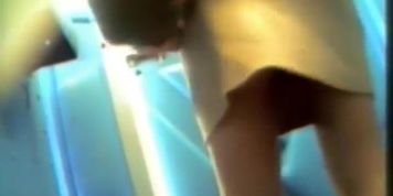 Sexy butted gal lifts and skirt and pisses on toilet spy cam