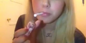 Blondi girl smoking cigarette