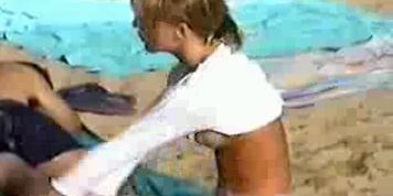 Blonde babe dressing at beach