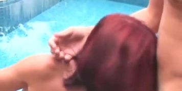 Sexy redhead Lana Starck gets a DP by the pool