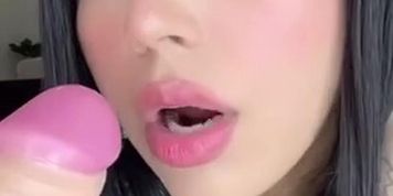 Latina sucks a dildo for a fan