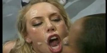 Blonde girl & Black girl share a bukkake