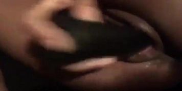Ebony playing with her black toy