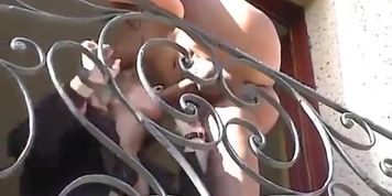 Blonde businesswoman fucks on balcony