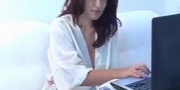 Hot redhead girl with big tits stripteasing and fingering her pussy on webcam