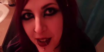 Short but sweet clip of young redhead goth girl giving smokey blowjob