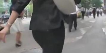 Street candid girl walking in front of me in tight pants