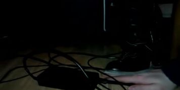 Candid boots trampling under desk