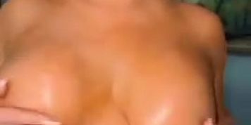 Jenni Oiling Her Boobs