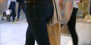 Candid ass in tight jeans and boots