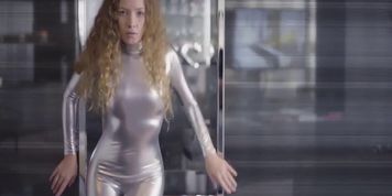 Girl Posing In Shiny Silver Spandex Catsuit 