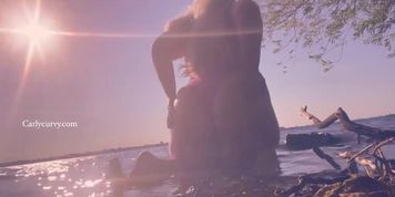 Bikini butt teasing in the water at a public beach!