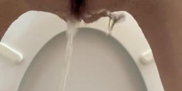 Rear view standing pee in toilet! Titties inluded!