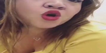 Who is this milf big butt Latina showing her ass up skirt in the office bathroom?