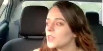 Sexy young brunette smoking & driving