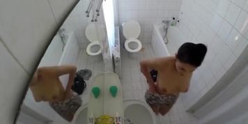 Beautiful housewife removes her clothes in order to wash her juicy holes
