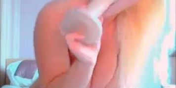 Blond model teasing her pink pussy in webcam chat