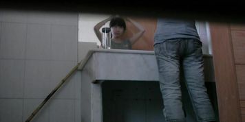 Dark haired asian chick pissing on hidden cam