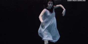 Aqua girl Andrejka underwater stripping and swimming