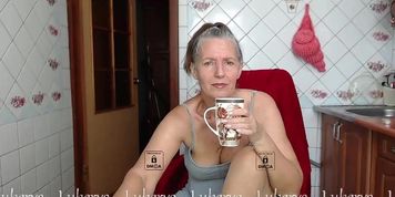 Lukerya does striptease in the kitchen after morning coffee