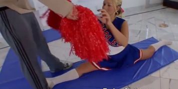 Blonde cheerleader blowing on cock