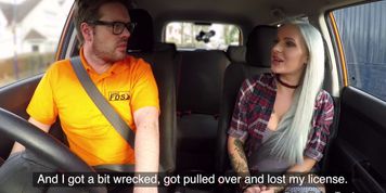 Busty tattooed blonde toys in car