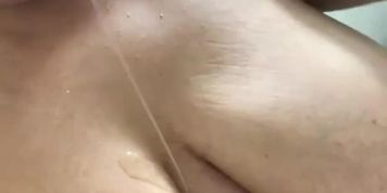 Busty Latina masturbates in shower