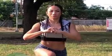 Fitness girl Tina Nguyen flexing muscle and squating