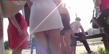 Young brunette girl in the upskirt outdoor video